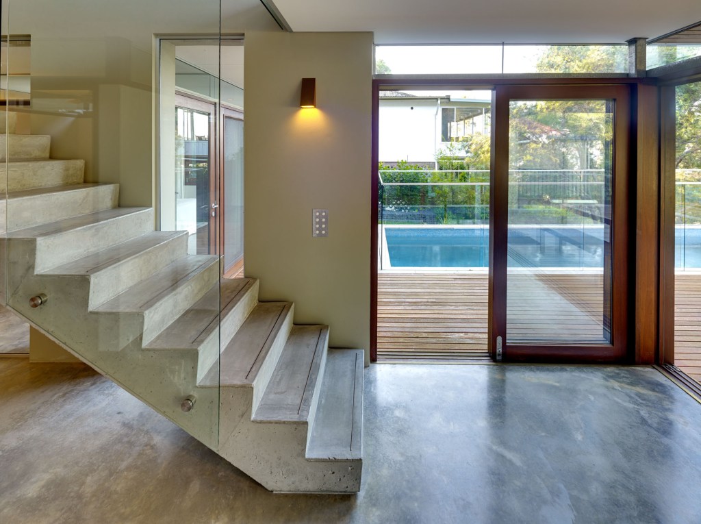 "Rear entertaining area with bushland surrounds at Pretty Beach House, NSW."